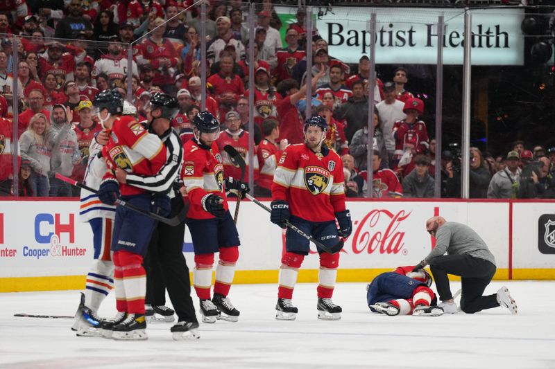 Jun 10, 2024; Sunrise, Florida, USA; Florida Panthers forward Eetu Luostarinen (27) is attended to by medical during the first period against the Edmonton Oilers in game two of the 2024 Stanley Cup Final at Amerant Bank Arena. Mandatory Credit: Jim Rassol-USA TODAY Sports