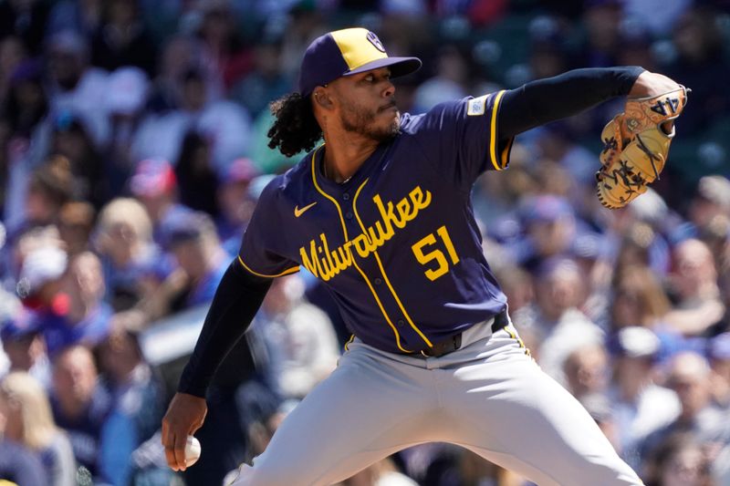 May 5, 2024; Chicago, Illinois, USA; Milwaukee Brewers pitcher Freddy Peralta (51) throws the ball against the Chicago Cubs during the first inning at Wrigley Field. Mandatory Credit: David Banks-USA TODAY Sports