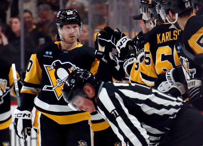 Feb 20, 2024; Pittsburgh, Pennsylvania, USA; Pittsburgh Penguins center Lars Eller (20) celebrates his goal with the Pens bench against the New York Islanders during the second period at PPG Paints Arena. New York won 5-4 in overtime. Mandatory Credit: Charles LeClaire-USA TODAY Sports