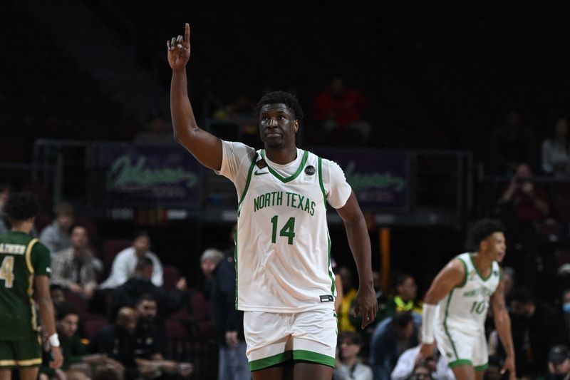 Mar 30, 2023; Las Vegas, NV, USA; North Texas Mean Green forward Moulaye Sissoko (14) celebrates the win over the UAB Blazers at Orleans Arena. Mandatory Credit: Candice Ward-USA TODAY Sports