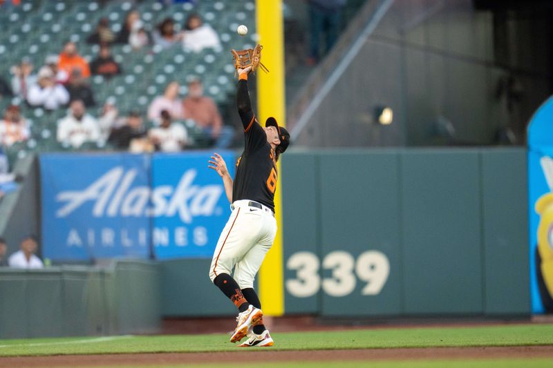 Sep 30, 2023; San Francisco, California, USA; San Francisco Giants third baseman Casey Schmitt (6) fields a fly ball against the Los Angeles Dodgers during the first inning at Oracle Park. Mandatory Credit: Neville E. Guard-USA TODAY Sports