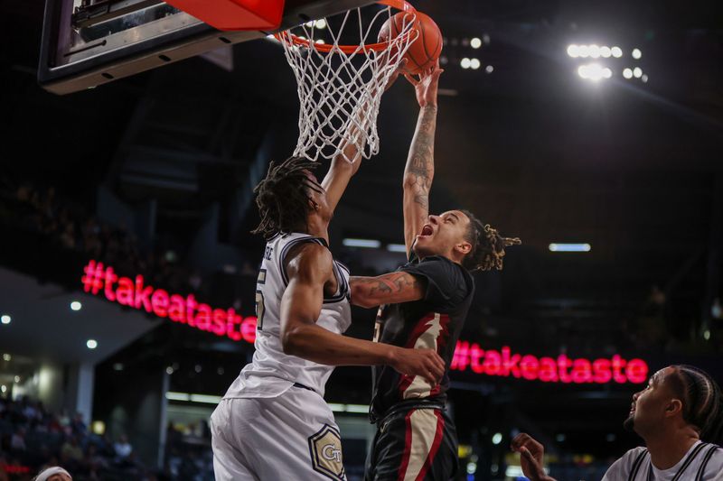 Mar 2, 2024; Atlanta, Georgia, USA; Florida State Seminoles forward De'Ante Green (5) has his shot blocked by Georgia Tech Yellow Jackets forward Tafara Gapare (5) in the first half at McCamish Pavilion. Mandatory Credit: Brett Davis-USA TODAY Sports
