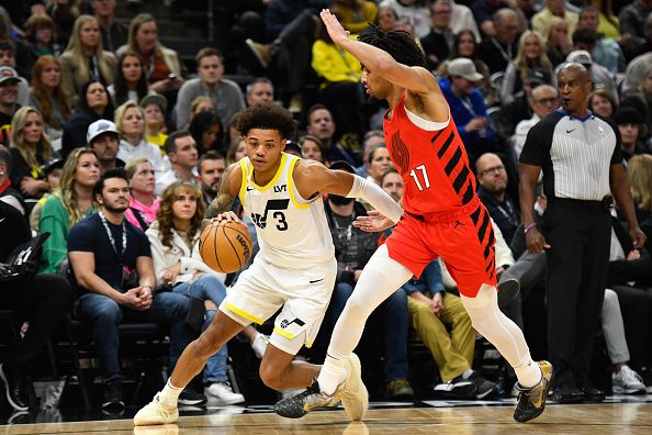 SALT LAKE CITY, UTAH - DECEMBER 02: Keyonte George #3 of the Utah Jazz drives under Shaedon Sharpe #17 of the Portland Trail Blazers during the first half of a game at Delta Center on December 02, 2023 in Salt Lake City, Utah. NOTE TO USER: User expressly acknowledges and agrees that, by downloading and or using this photograph, User is consenting to the terms and conditions of the Getty Images License Agreement. (Photo by Alex Goodlett/Getty Images)