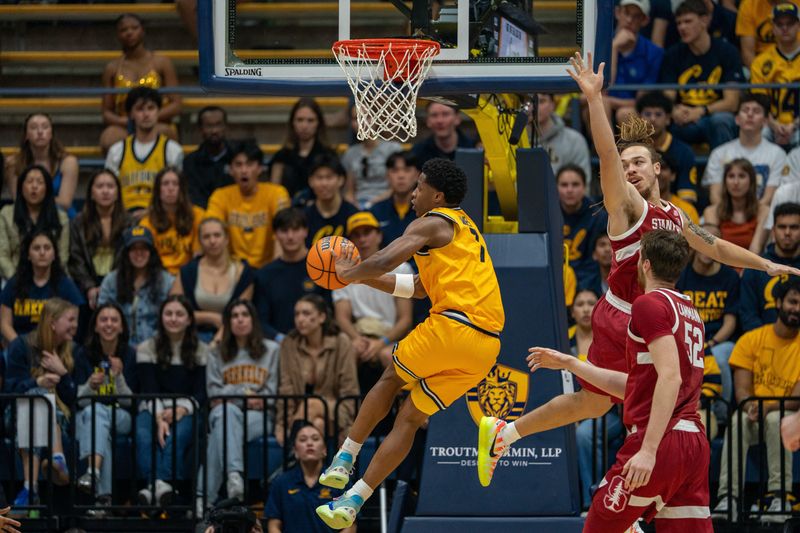 Feb 21, 2026; Berkeley, California, USA;  California Golden Bears guard Dai Dai Ames (7) during the drive to net passes the basketball against the Stanford Cardinals during the first half at Haas Pavilion. Mandatory Credit: Neville E. Guard-Imagn Images