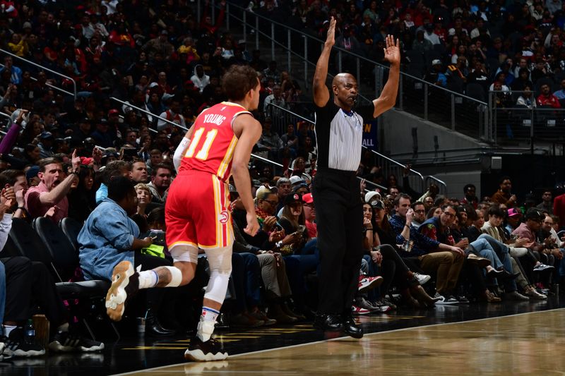 ATLANTA, GA - FEBRUARY 10: Trae Young #11 of the Atlanta Hawks looks on during the game against the Houston Rockets on February 10, 2024 at State Farm Arena in Atlanta, Georgia.  NOTE TO USER: User expressly acknowledges and agrees that, by downloading and/or using this Photograph, user is consenting to the terms and conditions of the Getty Images License Agreement. Mandatory Copyright Notice: Copyright 2024 NBAE (Photo by Scott Cunningham/NBAE via Getty Images)