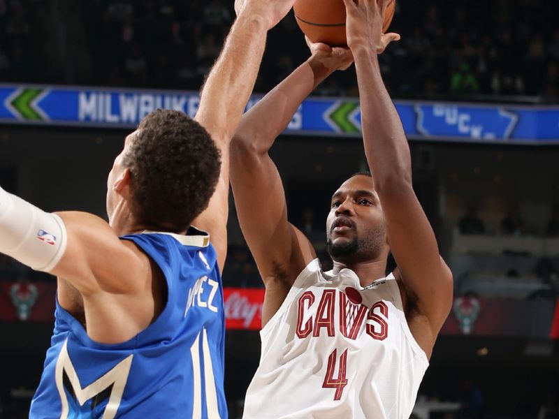 MILWAUKEE, WI - NOVEMBER 16: Evan Mobley #4 of the Cleveland Cavaliers shoots the ball during the game against the Milwaukee Bucks on November 16, 2022 at the Fiserv Forum Center in Milwaukee, Wisconsin. NOTE TO USER: User expressly acknowledges and agrees that, by downloading and or using this Photograph, user is consenting to the terms and conditions of the Getty Images License Agreement. Mandatory Copyright Notice: Copyright 2022 NBAE (Photo by Gary Dineen/NBAE via Getty Images).