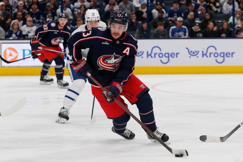 Dec 29, 2023; Columbus, Ohio, USA; Columbus Blue Jackets left wing Johnny Gaudreau (13) controls the puck against the Toronto Maple Leafs during the first period at Nationwide Arena. Mandatory Credit: Russell LaBounty-USA TODAY Sports