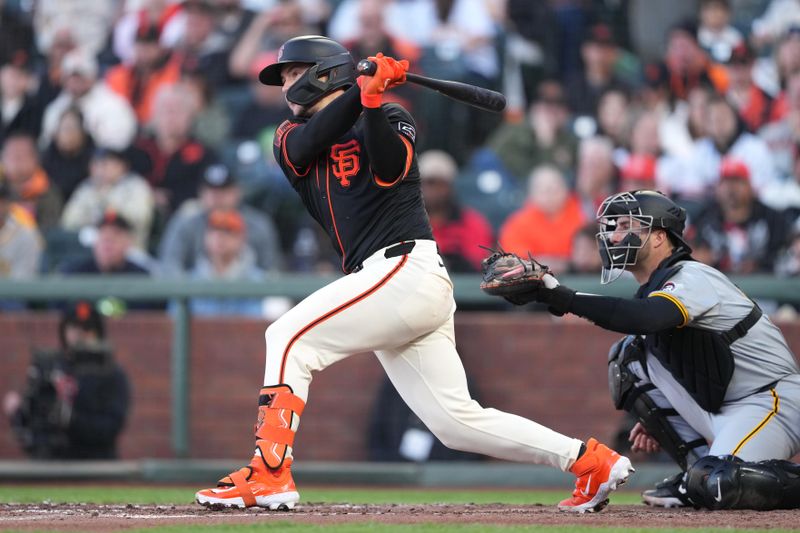 Apr 27, 2024; San Francisco, California, USA; San Francisco Giants catcher Patrick Bailey (14) hits a single against the Pittsburgh Pirates during the fourth inning at Oracle Park. Mandatory Credit: Darren Yamashita-USA TODAY Sports