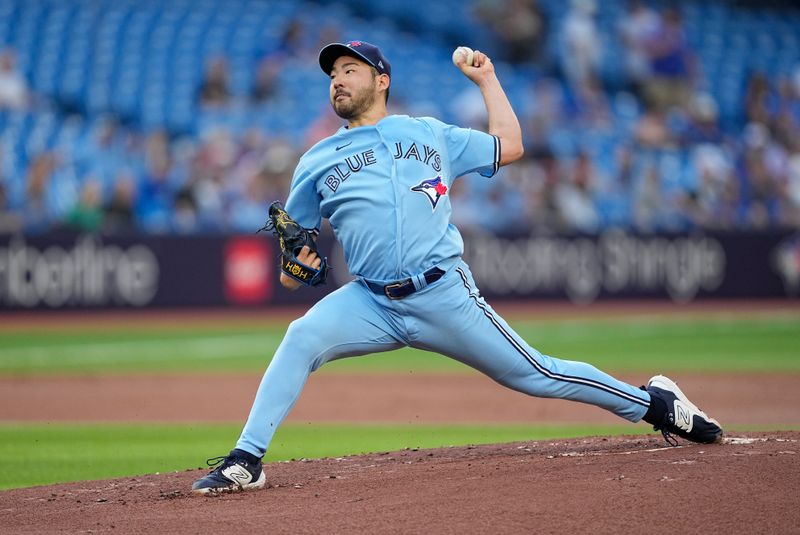 May 30, 2023; Toronto, Ontario, CAN; Toronto Blue Jays starting pitcher Yusei Kikuchi (16) pitches to the Milwaukee Brewers during the first inning at Rogers Centre. Mandatory Credit: John E. Sokolowski-USA TODAY Sports