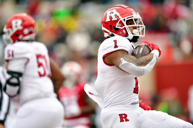 Nov 13, 2021; Bloomington, Indiana, USA;  The Rutgers Scarlet Knights running back Isaih Pacheco (1) breaks through the line for a touchdown during the first quarter against the Indiana Hoosiers at Memorial Stadium. Mandatory Credit: Marc Lebryk-USA TODAY Sports