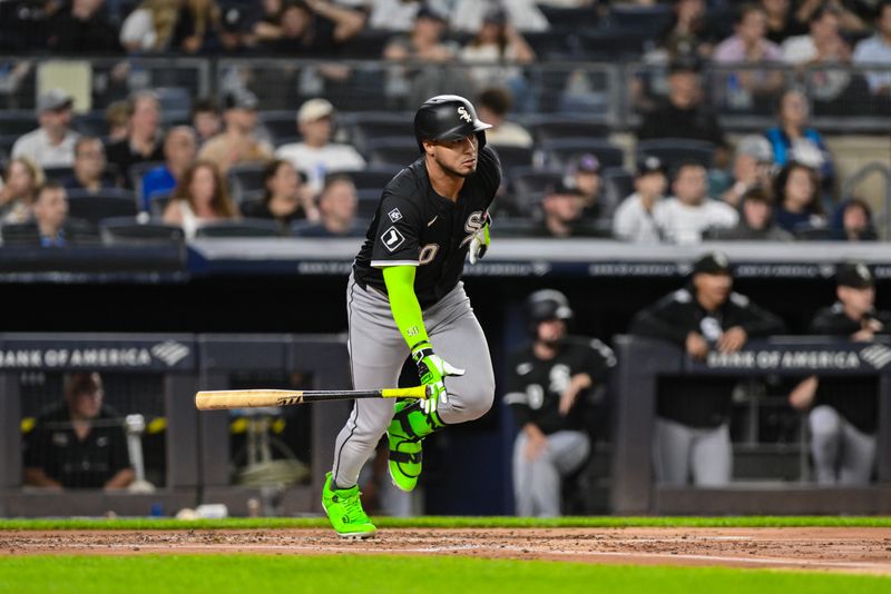 Sep 23, 2025; Bronx, New York, USA; Chicago White Sox second baseman Lenyn Sosa (50) hits a single against the New York Yankees during the second inning at Yankee Stadium. Mandatory Credit: John Jones-Imagn Images