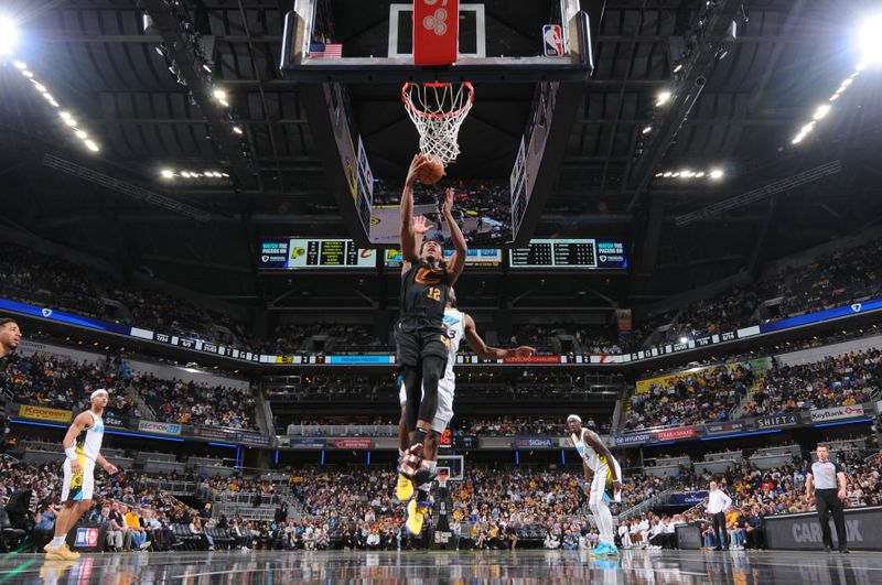 INDIANAPOLIS, IN - APRIL 10:  De'Andre Hunter #12 of the Cleveland Cavaliers drives to the basket during the game against the Indiana Pacers   on April 10, 2025 at Gainbridge Fieldhouse in Indianapolis, Indiana. NOTE TO USER: User expressly acknowledges and agrees that, by downloading and or using this Photograph, user is consenting to the terms and conditions of the Getty Images License Agreement. Mandatory Copyright Notice: Copyright 2025 NBAE (Photo by Ron Hoskins/NBAE via Getty Images)