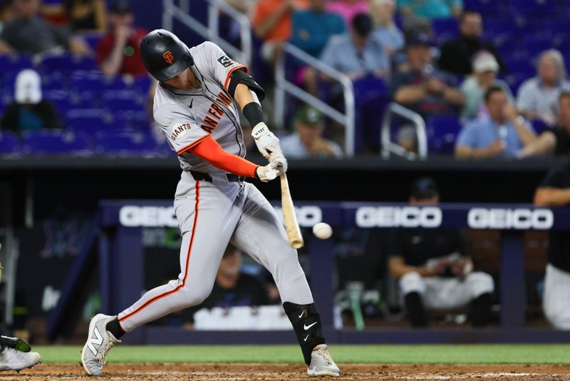 Apr 17, 2024; Miami, Florida, USA; San Francisco Giants left fielder Tyler Fitzgerald (49) hits a single against the Miami Marlins during the sixth inning at loanDepot Park. Mandatory Credit: Sam Navarro-USA TODAY Sports