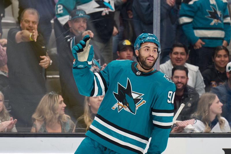 Dec 12, 2023; San Jose, California, USA; San Jose Sharks right wing Justin Bailey (90) acknowledges the crowd after scoring a goal against the Winnipeg Jets during the first period at SAP Center at San Jose. Mandatory Credit: Robert Edwards-USA TODAY Sports