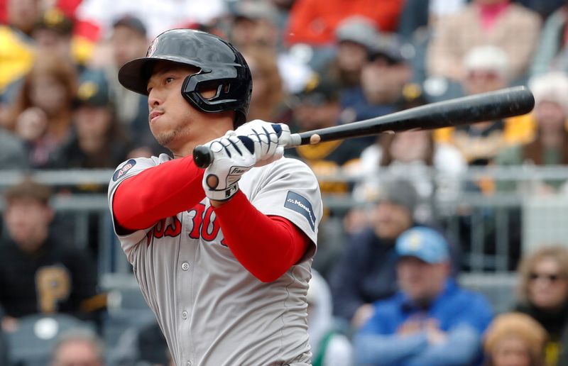 Apr 21, 2024; Pittsburgh, Pennsylvania, USA;  Boston Red Sox  right fielder Rob Refsnyder (30) hits an RBI double against the Pittsburgh Pirates during the third inning at PNC Park. Mandatory Credit: Charles LeClaire-USA TODAY Sports