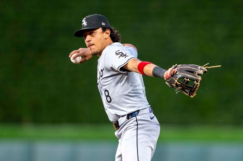 Apr 22, 2024; Minneapolis, Minnesota, USA; Chicago White Sox second baseman Nicky Lopez (8) throws the ball to first base for an out against the Minnesota Twins in the fifth inning at Target Field. Mandatory Credit: Jesse Johnson-USA TODAY Sports