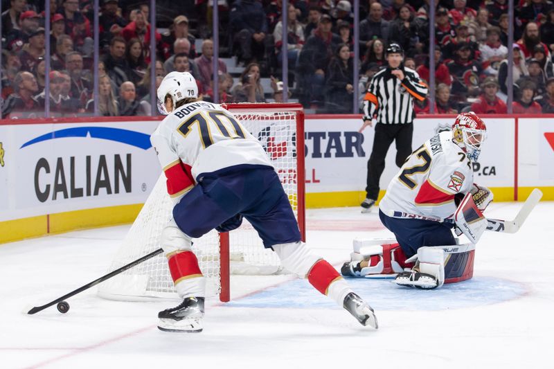 Oct 10, 2024; Ottawa, Ontario, CAN; Florida Panthers center Jesper Boqvist (72) moves the puck following a save by goalie Sergei Bobrovsky (72) in the first period against the Ottawa Senators at the Canadian Tire Centre. Mandatory Credit: Marc DesRosiers-Imagn Images