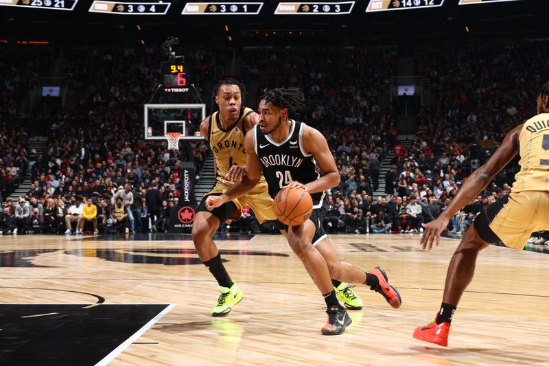 TORONTO, CANADA - FEBRUARY 22: Cam Thomas #24 of the Brooklyn Nets drives to the basket during the game against the Toronto Raptors on February 22, 2024 at the Scotiabank Arena in Toronto, Ontario, Canada.  NOTE TO USER: User expressly acknowledges and agrees that, by downloading and or using this Photograph, user is consenting to the terms and conditions of the Getty Images License Agreement.  Mandatory Copyright Notice: Copyright 2024 NBAE (Photo by Vaughn Ridley/NBAE via Getty Images)