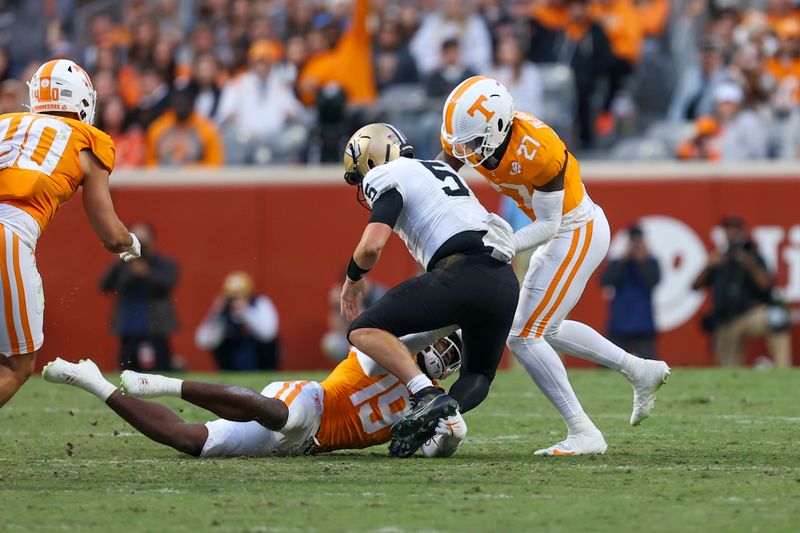 Nov 25, 2023; Knoxville, Tennessee, USA; Tennessee Volunteers defensive lineman Joshua Josephs (19) and defensive lineman James Pearce Jr. (27) sack Vanderbilt Commodores quarterback AJ Swann (5) during the first half at Neyland Stadium. Mandatory Credit: Randy Sartin-USA TODAY Sports