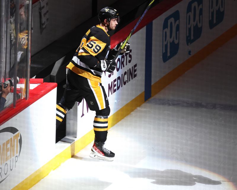 Mar 31, 2026; Pittsburgh, Pennsylvania, USA; Pittsburgh Penguins right wing Egor Chinakhov (59) reacts to being named first star of the game against the Detroit Red Wings at PPG Paints Arena. Mandatory Credit: Charles LeClaire-Imagn Images Mar 31, 2026; Pittsburgh, Pennsylvania, USA; Pittsburgh Penguins right wing Egor Chinakhov (59) reacts to being named first star of the game against the Detroit Red Wings at PPG Paints Arena. Mandatory Credit: Charles LeClaire-Imagn Images