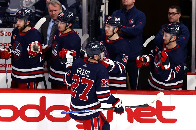 Apr 2, 2023; Winnipeg, Manitoba, CAN; Winnipeg Jets left wing Nikolaj Ehlers (27) celebrates his third period goal against the New Jersey Devils at Canada Life Centre. Mandatory Credit: James Carey Lauder-USA TODAY Sports