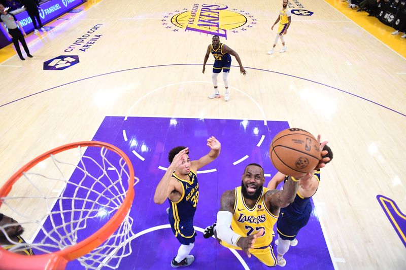 LOS ANGELES, CA - APRIL 9: LeBron James #23 of the Los Angeles Lakers drives to the basket during the game against the Golden State Warriors on April 9, 2024 at Crypto.Com Arena in Los Angeles, California. NOTE TO USER: User expressly acknowledges and agrees that, by downloading and/or using this Photograph, user is consenting to the terms and conditions of the Getty Images License Agreement. Mandatory Copyright Notice: Copyright 2024 NBAE (Photo by Adam Pantozzi/NBAE via Getty Images)