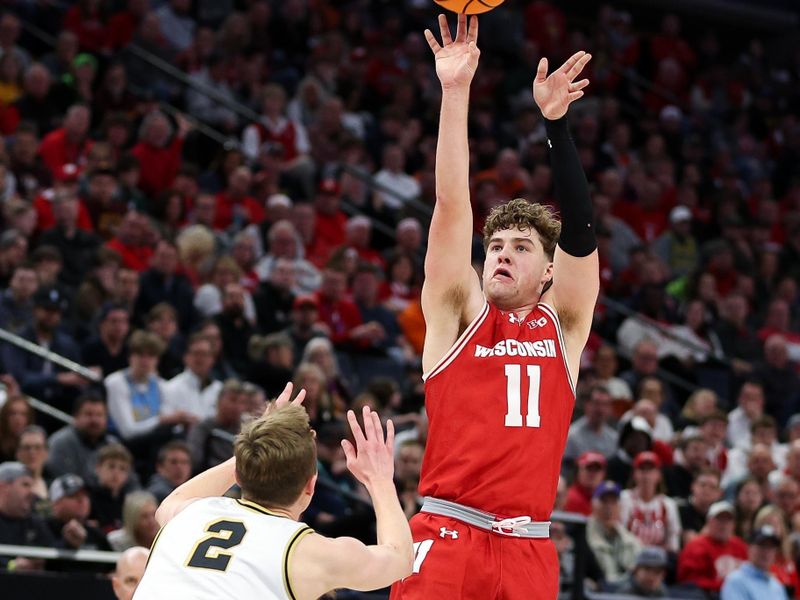 Mar 16, 2024; Minneapolis, MN, USA; Wisconsin Badgers guard Max Klesmit (11) shoots as Purdue Boilermakers guard Fletcher Loyer (2) defends during the second half at Target Center. Mandatory Credit: Matt Krohn-USA TODAY Sports