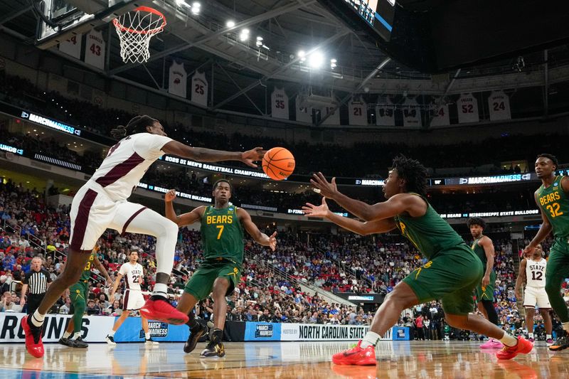 Mar 21, 2025; Raleigh, NC, USA; Baylor Bears guard Jeremy Roach (3) goes after a loose ball against Baylor Bears guard VJ Edgecombe (7) and guard Robert Wright III (1) during the second half in the first round of the NCAA Tournament at Lenovo Center. Mandatory Credit: Bob Donnan-Imagn Images