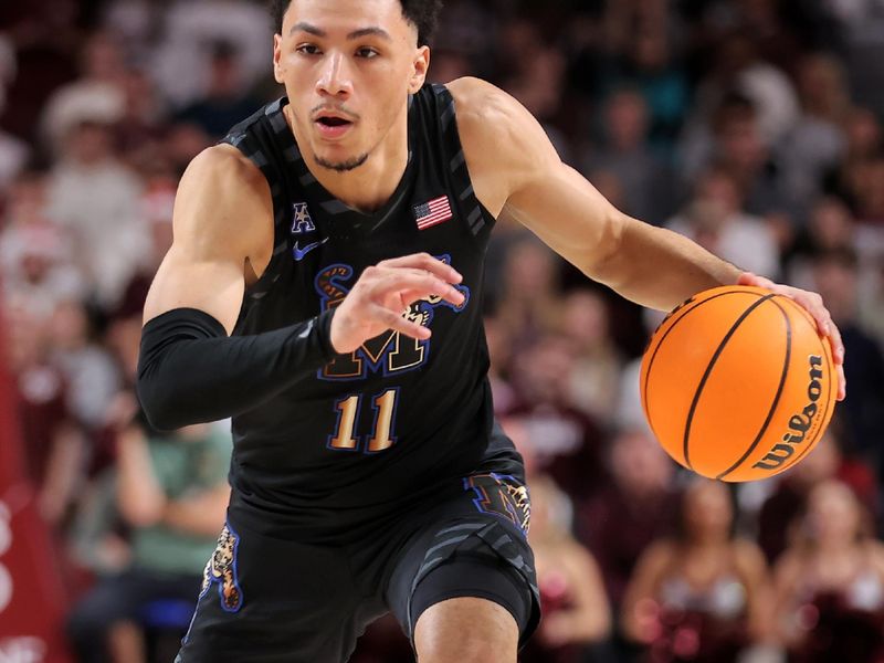 Dec 10, 2023; College Station, Texas, USA; Memphis Tigers guard Jahvon Quinerly (11) handles the ball against the Texas A&M Aggies during the second half during the second half at Reed Arena. Mandatory Credit: Erik Williams-USA TODAY Sports