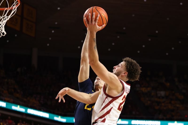 Feb 27, 2023; Ames, Iowa, USA; Iowa State Cyclones guard Gabe Kalscheur (22) scores in front of West Virginia Mountaineers forward Patrick Suemnick (24) during the second half at James H. Hilton Coliseum. Mandatory Credit: Reese Strickland-USA TODAY Sports