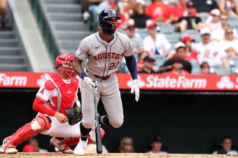 Sep 15, 2024; Anaheim, California, USA;  Houston Astros left fielder Jason Heyward (22) hits an RBI single during the fourth inning against the Los Angeles Angels at Angel Stadium. Mandatory Credit: Kiyoshi Mio-Imagn Images