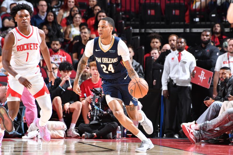 HOUSTON, TX - OCTOBER 15: Jordan Hawkins #24 of the New Orleans Pelicans drives to the basket during the game against the Houston Rockets during a NBA preseason game on October 15, 2024 at the Toyota Center in Houston, Texas. NOTE TO USER: User expressly acknowledges and agrees that, by downloading and or using this photograph, User is consenting to the terms and conditions of the Getty Images License Agreement. Mandatory Copyright Notice: Copyright 2024 NBAE (Photo by Logan Riely/NBAE via Getty Images)