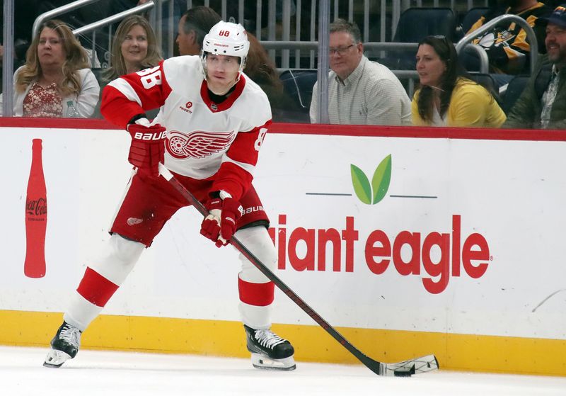 Nov 13, 2024; Pittsburgh, Pennsylvania, USA;  Detroit Red Wings right wing Patrick Kane (88) handles the puck against the Pittsburgh Penguins during the third period at PPG Paints Arena. Mandatory Credit: Charles LeClaire-Imagn Images