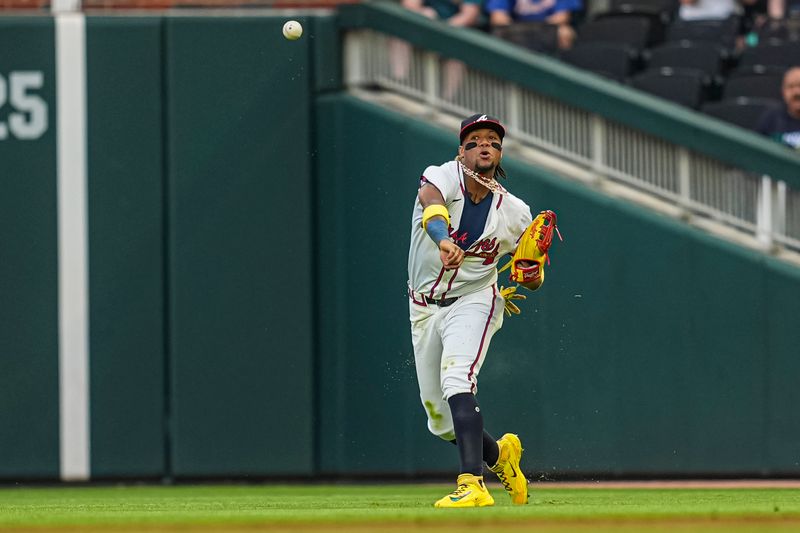 May 14, 2024; Cumberland, Georgia, USA; Atlanta Braves right fielder Ronald Acuna Jr (13) throws to second base for a force out on Chicago Cubs center fielder Pete Crow-Armstrong (52) (not shown) during the third inning at Truist Park. Mandatory Credit: Dale Zanine-USA TODAY Sports