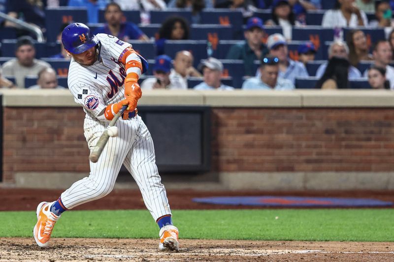 Jul 9, 2024; New York City, New York, USA;  New York Mets catcher Francisco Alvarez (4) hits a single in the fifth inning against the Washington Nationals at Citi Field. Mandatory Credit: Wendell Cruz-USA TODAY Sports