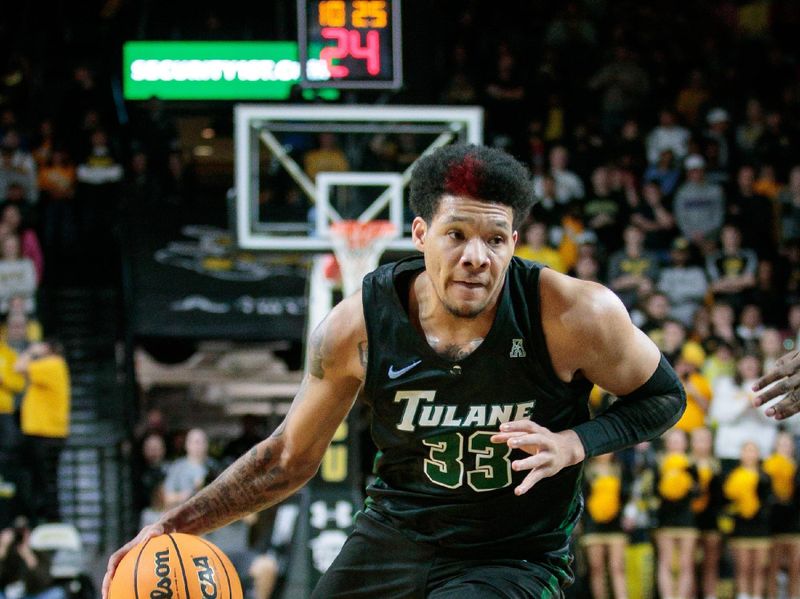 Jan 25, 2023; Wichita, Kansas, USA; Tulane Green Wave forward Tylan Pope (33) drives to the basket during the first half against the Wichita State Shockers at Charles Koch Arena. Mandatory Credit: William Purnell-USA TODAY Sports