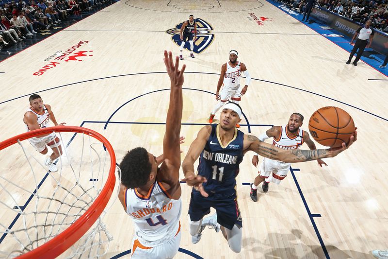 NEW ORLEANS, LA - DECEMBER 5: Jalen Crutcher #11 of the New Orleans Pelicans drives to the basket during the game against the Phoenix Suns on December 5, 2024 at the Smoothie King Center in New Orleans, Louisiana. NOTE TO USER: User expressly acknowledges and agrees that, by downloading and or using this Photograph, user is consenting to the terms and conditions of the Getty Images License Agreement. Mandatory Copyright Notice: Copyright 2024 NBAE (Photo by Layne Murdoch Jr./NBAE via Getty Images)