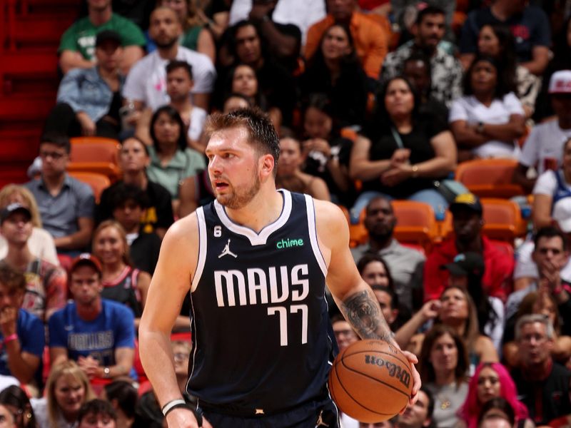 MIAMI, FL - APRIL 1: Luka Doncic #77 of the Dallas Mavericks handles the ball during the game against the Miami Heat  on April 1, 2023 at Miami-Dade Arena in Miami, Florida. NOTE TO USER: User expressly acknowledges and agrees that, by downloading and or using this Photograph, user is consenting to the terms and conditions of the Getty Images License Agreement. Mandatory Copyright Notice: Copyright 2023 NBAE (Photo by Issac Baldizon/NBAE via Getty Images)