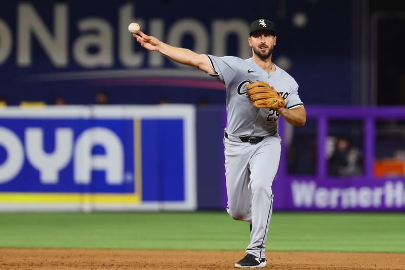 Jul 5, 2024; Miami, Florida, USA; Chicago White Sox shortstop Paul DeJong (29) throws to first base to retire Miami Marlins second baseman Vidal Brujan (not pictured) during the fifth inning at loanDepot Park. Mandatory Credit: Sam Navarro-USA TODAY Sports