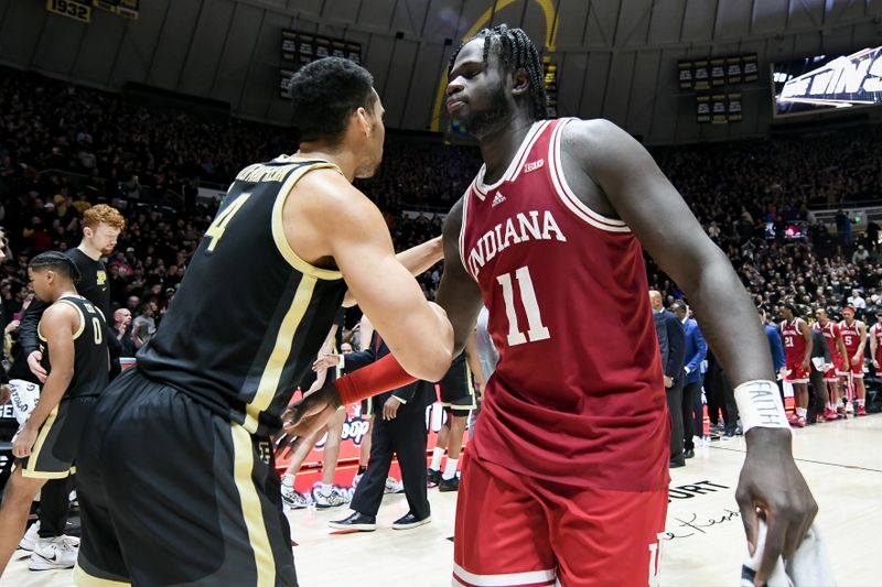 Jan 31, 2025; West Lafayette, Indiana, USA; Purdue Boilermakers forward Trey Kaufman-Renn (4) and Indiana Hoosiers center Oumar Ballo (11) greet each other after the game at Mackey Arena. Mandatory Credit: Robert Goddin-Imagn Images