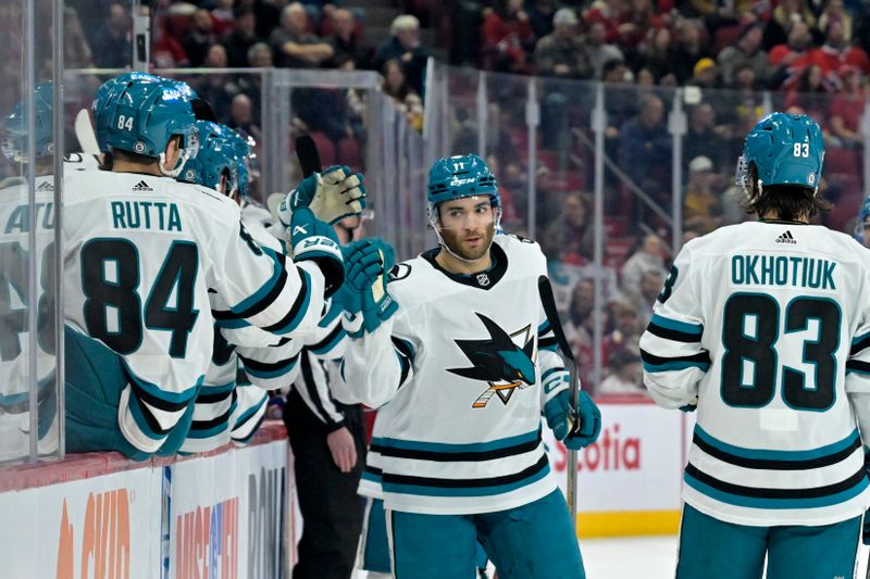 Jan 11, 2024; Montreal, Quebec, CAN; San Jose Sharks forward Luke Kunin (11) celebrates with teammates after scoring a goal against the Montreal Canadiens during the first period at the Bell Centre. Mandatory Credit: Eric Bolte-USA TODAY Sports