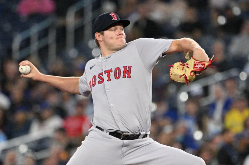 Sep 25, 2024; Toronto, Ontario, CAN;  Boston Red Sox starting pitcher Richard Pitts (80) delivers a pitch against the Toronto Blue Jays in the first inning at Rogers Centre. Mandatory Credit: Dan Hamilton-Imagn Images