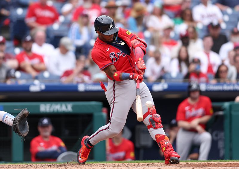 May 29, 2025; Philadelphia, Pennsylvania, USA; Atlanta Braves outfielder Ronald Acuña Jr. (13) hits an RBI single during the sixth inning against the Philadelphia Phillies at Citizens Bank Park. Mandatory Credit: Bill Streicher-Imagn Images