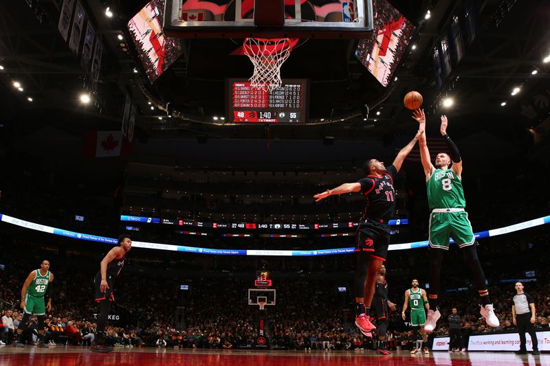 TORONTO, CANADA - JANUARY 15:  Kristaps Porzingis #8 of the Boston Celtics shoots the ball during the game against the Toronto Raptors on January 15, 2024 at the Scotiabank Arena in Toronto, Ontario, Canada.  NOTE TO USER: User expressly acknowledges and agrees that, by downloading and or using this Photograph, user is consenting to the terms and conditions of the Getty Images License Agreement.  Mandatory Copyright Notice: Copyright 2024 NBAE (Photo by Vaughn Ridley/NBAE via Getty Images)