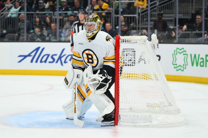 Jan 6, 2026; Seattle, Washington, USA; Boston Bruins goaltender Jeremy Swayman (1) defends the goal against the Seattle Kraken during the second period at Climate Pledge Arena. Mandatory Credit: Steven Bisig-Imagn Images
