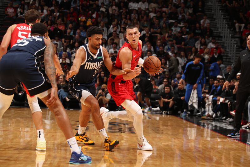 MIAMI, FL - NOVEMBER 24: Tyler Herro #14 of the Miami Heat dribbles the ball during the game against the Dallas Mavericks on November 24, 2024 at Kaseya Center in Miami, Florida. NOTE TO USER: User expressly acknowledges and agrees that, by downloading and or using this Photograph, user is consenting to the terms and conditions of the Getty Images License Agreement. Mandatory Copyright Notice: Copyright 2024 NBAE (Photo by Issac Baldizon/NBAE via Getty Images)