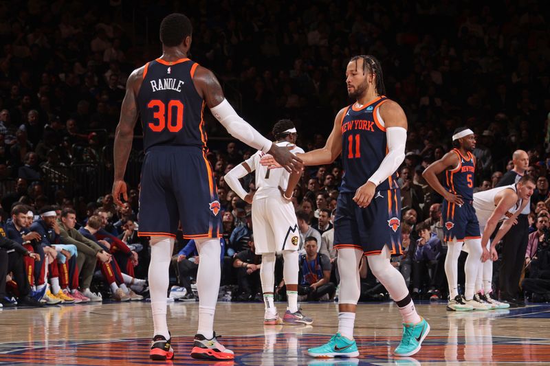 NEW YORK, NY - JANUARY 25: Julius Randle #30 and Jalen Brunson #11 of the New York Knicks high five during the game against the Denver Nuggets on January 25, 2024 at Madison Square Garden in New York City, New York.  NOTE TO USER: User expressly acknowledges and agrees that, by downloading and or using this photograph, User is consenting to the terms and conditions of the Getty Images License Agreement. Mandatory Copyright Notice: Copyright 2024 NBAE  (Photo by Nathaniel S. Butler/NBAE via Getty Images)