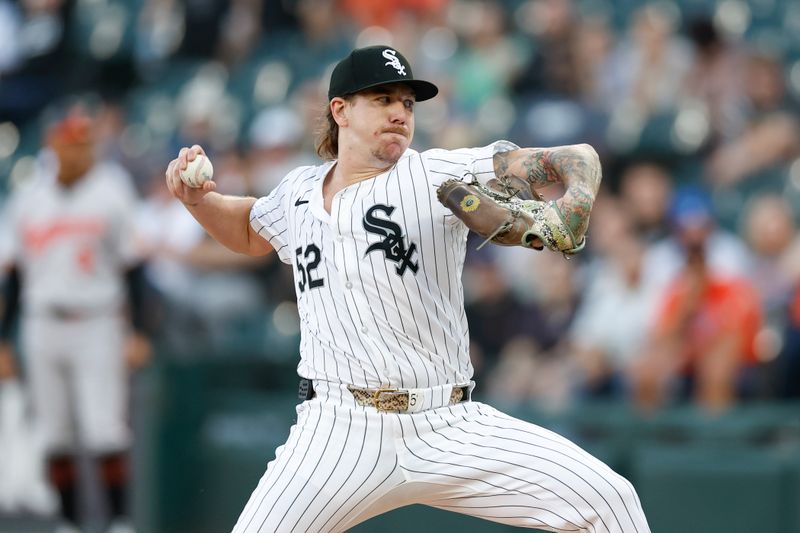 May 23, 2024; Chicago, Illinois, USA; Chicago White Sox starting pitcher Mike Clevinger (52) delivers a pitch against the Baltimore Orioles during the first inning at Guaranteed Rate Field. Mandatory Credit: Kamil Krzaczynski-USA TODAY Sports