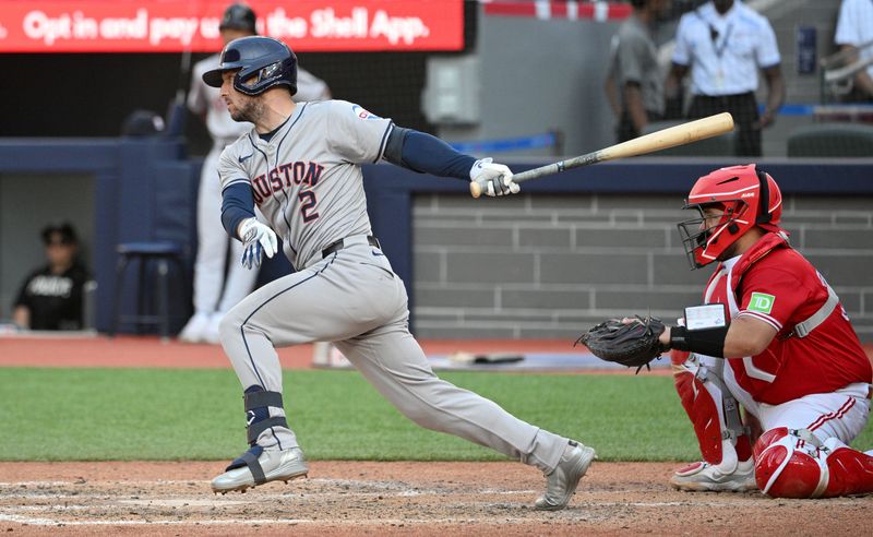 Jul 1, 2024; Toronto, Ontario, CAN;  Houston Astros third baseman Alex Bregman (2) hits a single against the Toronto Blue Jays in the ninth inning at Rogers Centre. Mandatory Credit: Dan Hamilton-USA TODAY Sports