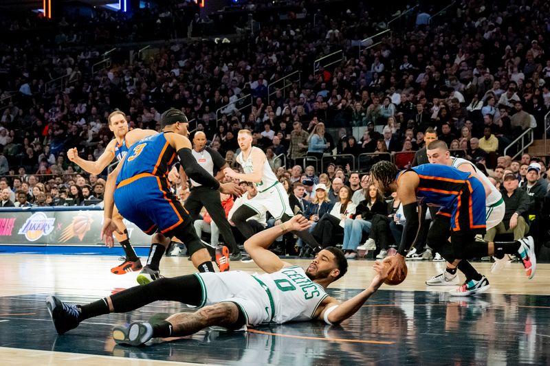 NEW YORK, NEW YORK - FEBRUARY 24:  Jayson Tatum #0 of the Boston Celtics gets tripped up against the New York Knicks during the second half at Madison Square Garden on February 24, 2024 in New York City. NOTE TO USER: User expressly acknowledges and agrees that, by downloading and or using this photograph, User is consenting to the terms and conditions of the Getty Images License Agreement. (Photo by Steven Ryan/Getty Images)